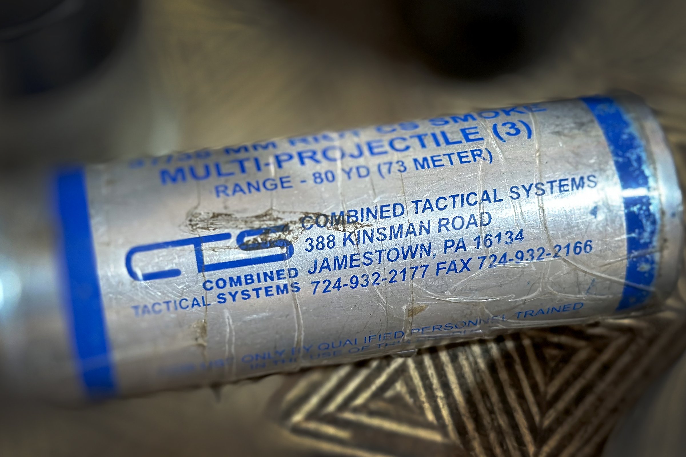 Close-up of a CS smoke projectile manufactured by Combined Tactical Systems, Jamestown, Pennsylvania